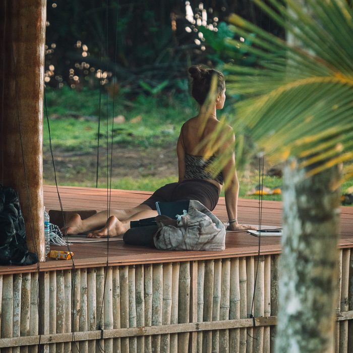 Practicing yoga asanas (postures) on a breathtaking beach overlooking the turquoise waters of southern Sri Lanka